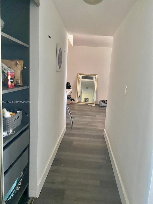 corridor featuring dark hardwood / wood-style floors