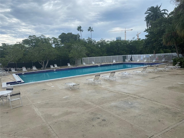 view of swimming pool with a patio