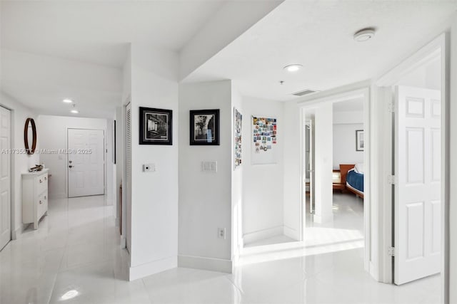 hallway with light tile patterned floors