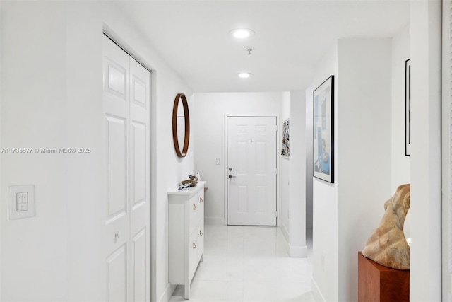 corridor with light tile patterned floors