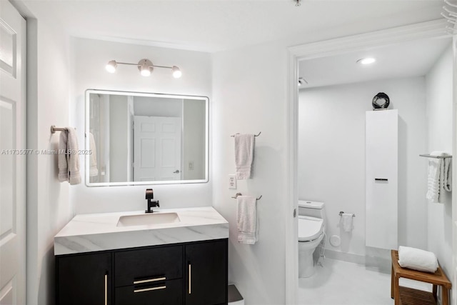 bathroom with vanity and toilet