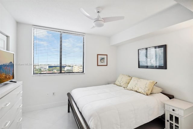 bedroom with light tile patterned floors and ceiling fan