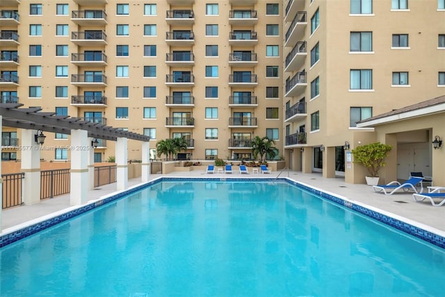 view of pool featuring a patio and a pergola