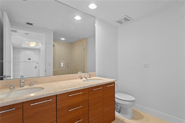 bathroom featuring vanity, an enclosed shower, tile patterned floors, and toilet