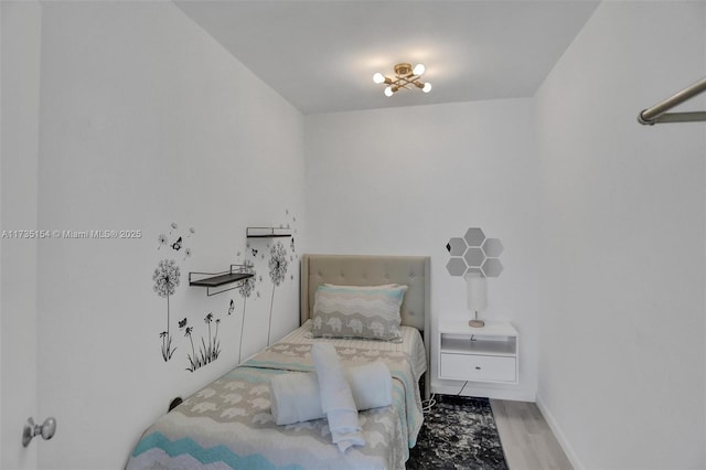 bedroom with light wood-type flooring