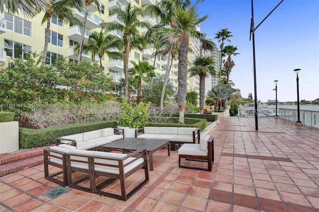 view of community with an outdoor hangout area and a patio