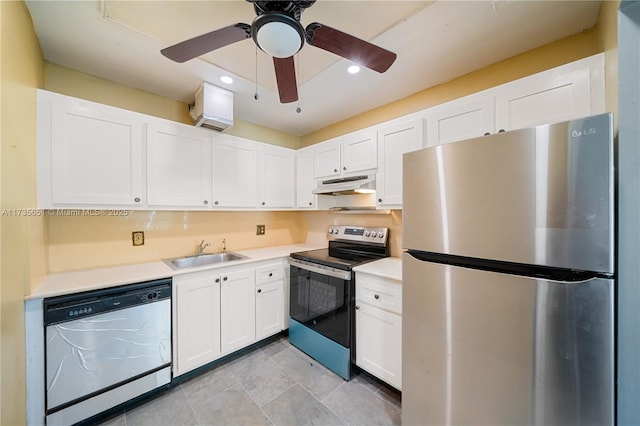 kitchen featuring light tile patterned flooring, sink, ceiling fan, stainless steel appliances, and white cabinets