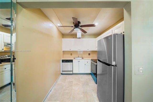 kitchen featuring white cabinetry, ceiling fan, stainless steel appliances, and sink