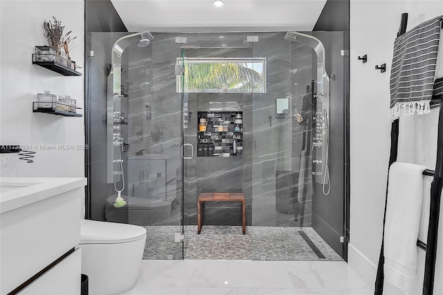 bathroom with vanity, toilet, and a shower with door