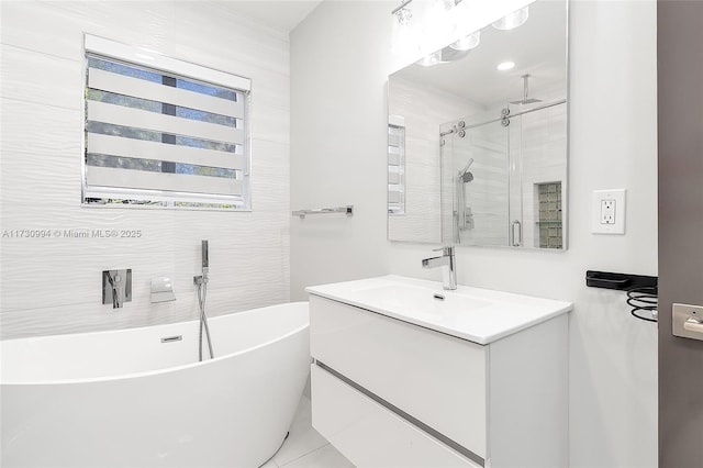 bathroom with vanity and separate shower and tub