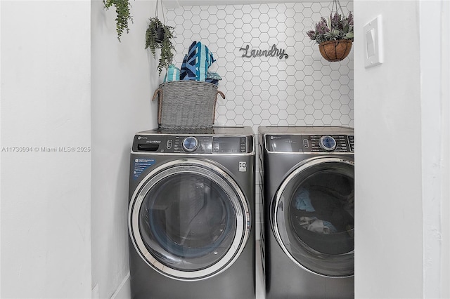 laundry room featuring washing machine and dryer