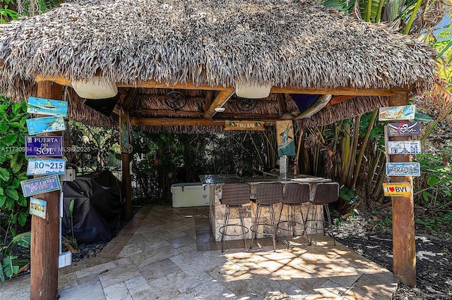 view of patio featuring a gazebo and exterior bar