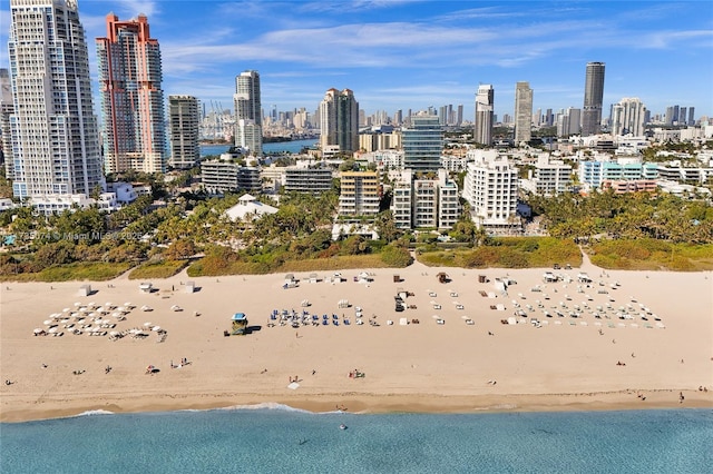 city view featuring a water view and a beach view