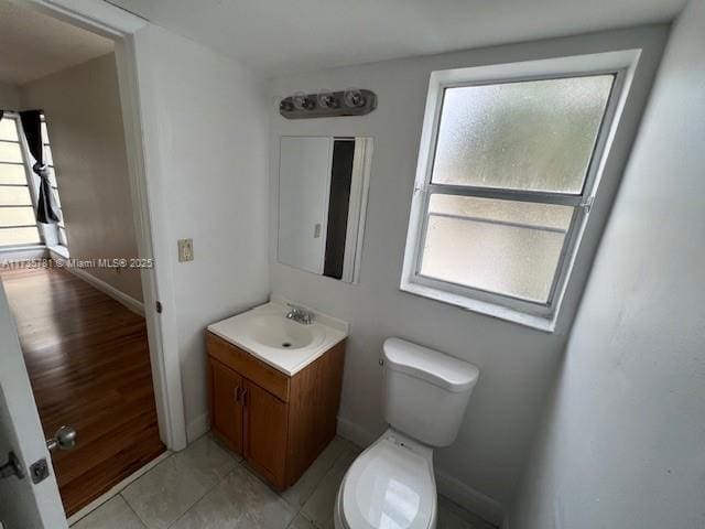 bathroom with tile patterned floors, vanity, and toilet