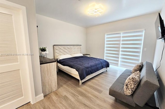 bedroom featuring light wood-style flooring