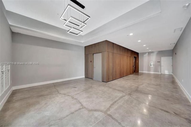 bonus room with recessed lighting, baseboards, and finished concrete floors