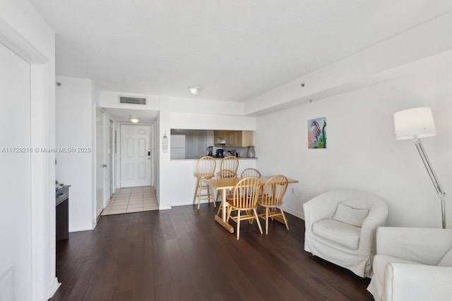 dining area with wood-type flooring