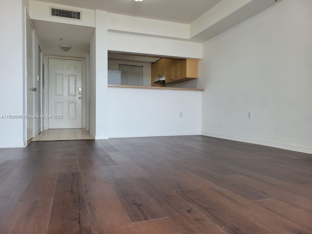 unfurnished living room featuring light hardwood / wood-style floors