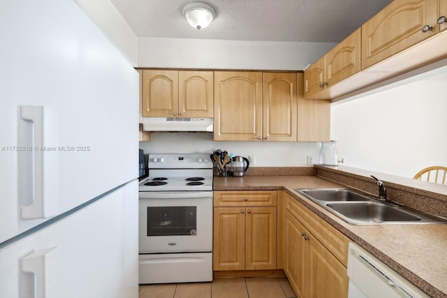 kitchen with light tile patterned flooring, white appliances, light brown cabinetry, and sink