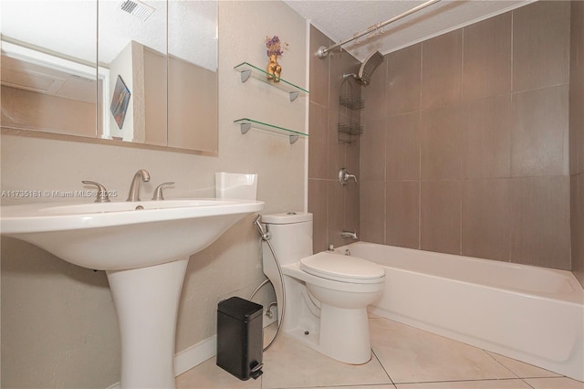 full bathroom with toilet, a sink, bathing tub / shower combination, visible vents, and tile patterned floors