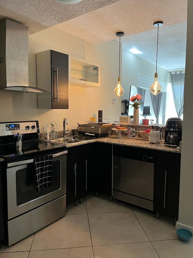 kitchen with light tile patterned flooring, sink, a textured ceiling, electric stove, and wall chimney range hood