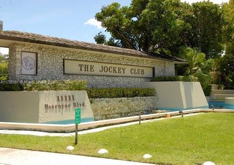 community sign featuring a lawn