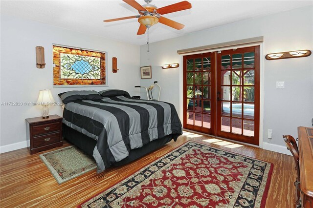 bedroom with ceiling fan, access to outside, french doors, and wood-type flooring