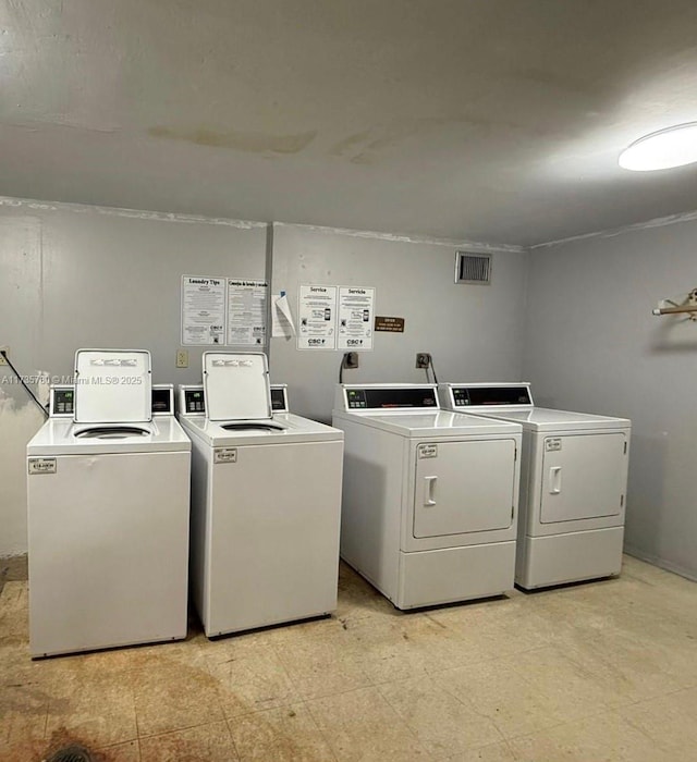 washroom with washing machine and dryer