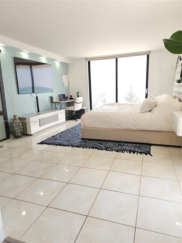 bedroom with light tile patterned floors