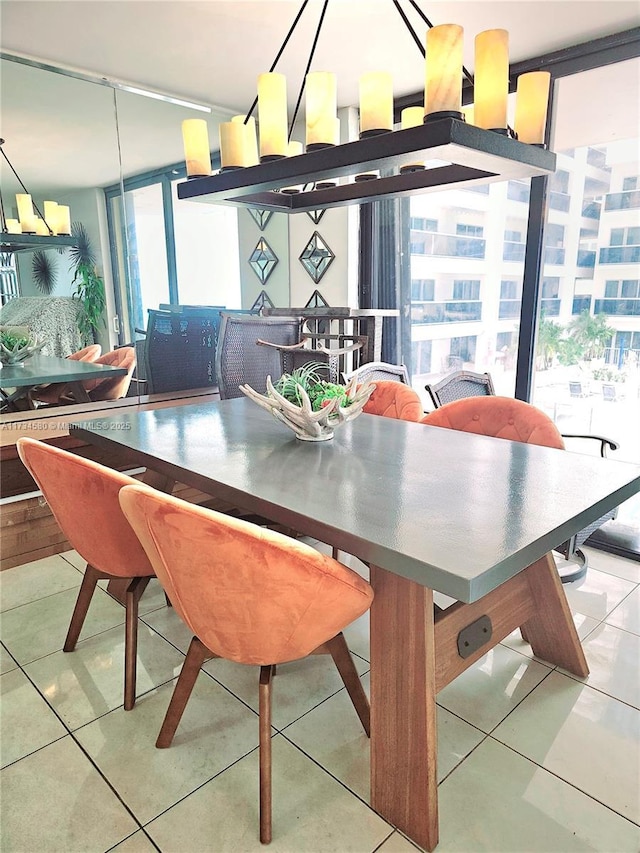 dining area with light tile patterned flooring and floor to ceiling windows