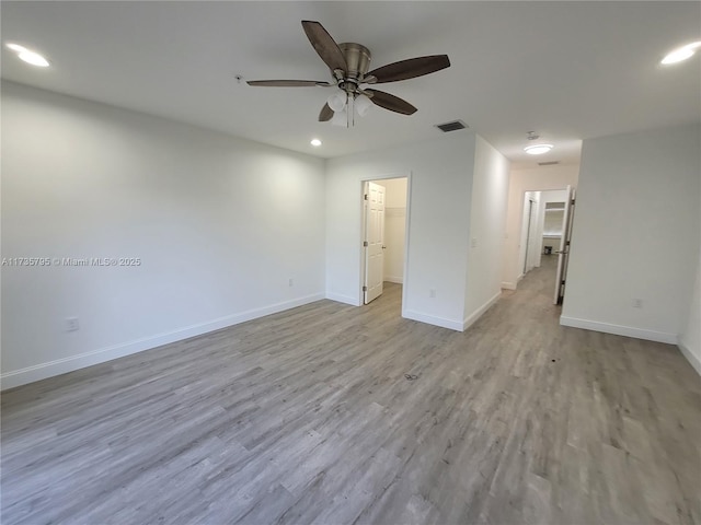 unfurnished room featuring recessed lighting, visible vents, ceiling fan, light wood-type flooring, and baseboards