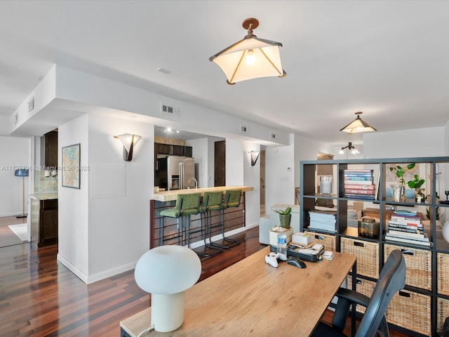 dining area featuring dark hardwood / wood-style flooring