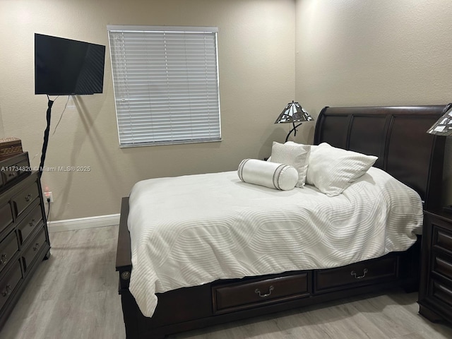 bedroom featuring light wood-type flooring