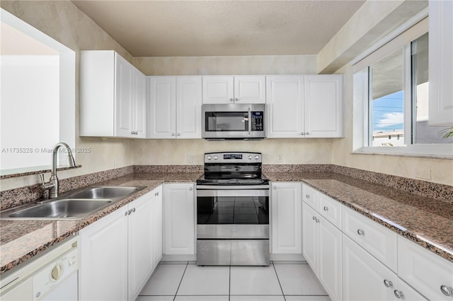 kitchen featuring white cabinetry and stainless steel appliances