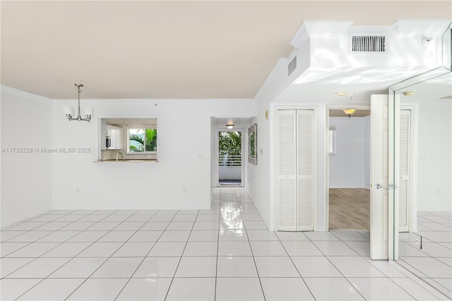 spare room featuring light tile patterned floors