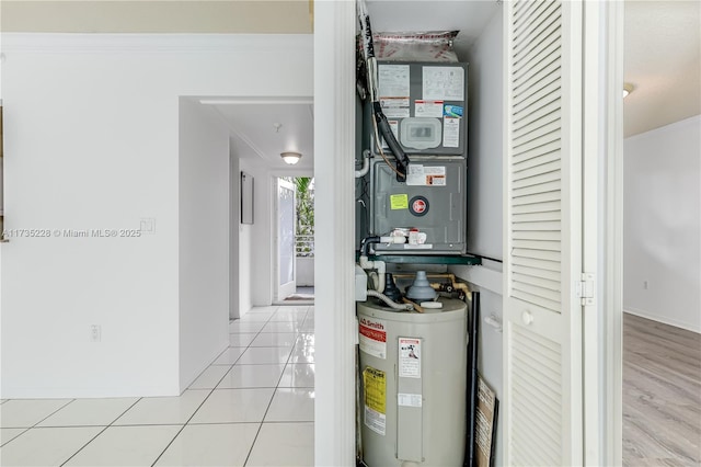 utility room with electric water heater