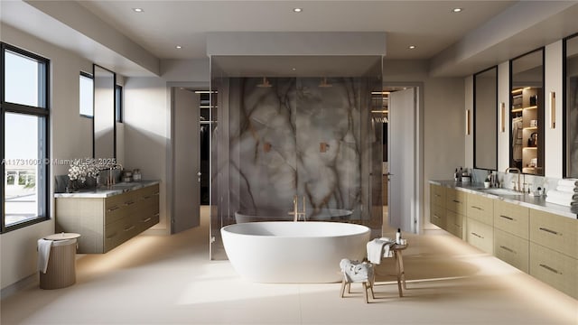 bathroom featuring recessed lighting, a soaking tub, and vanity