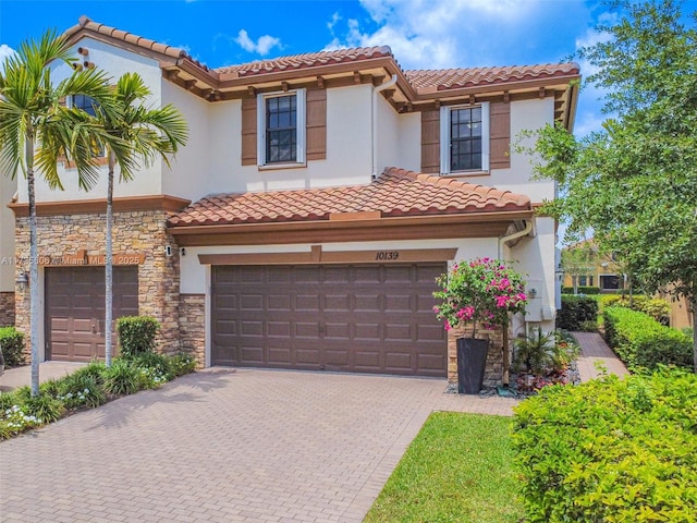 mediterranean / spanish house featuring a garage