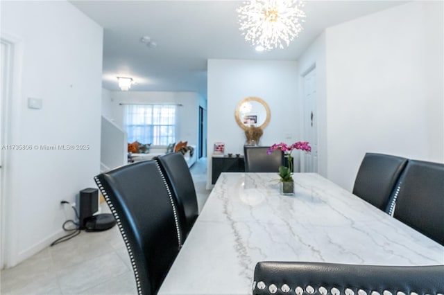 dining space with a notable chandelier