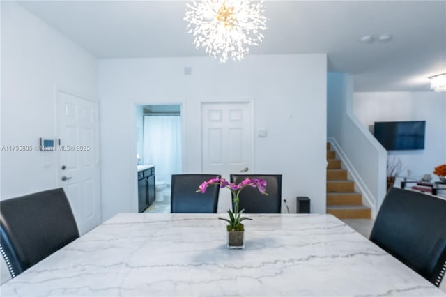 dining space with a chandelier