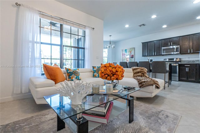 living room with a notable chandelier