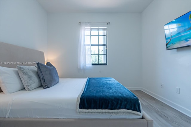 bedroom featuring hardwood / wood-style floors