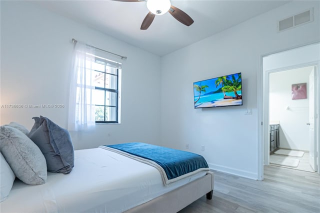 bedroom with hardwood / wood-style flooring and ceiling fan