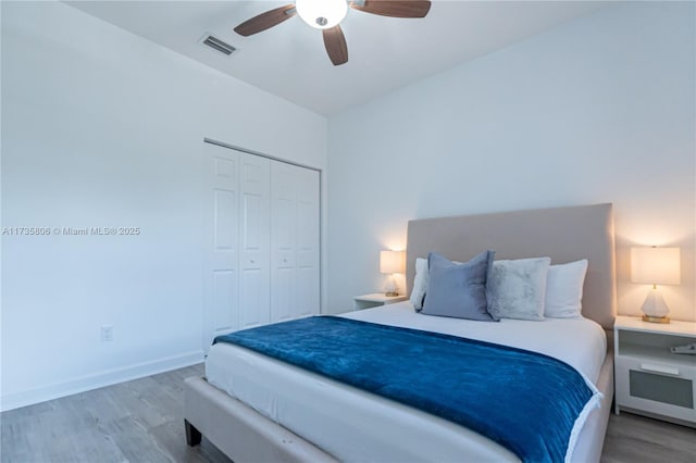 bedroom with ceiling fan, a closet, and light wood-type flooring