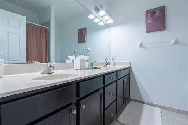 bathroom featuring tile patterned flooring and vanity