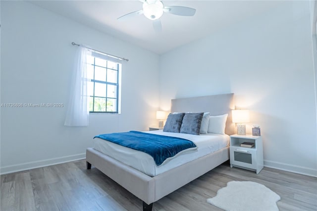 bedroom featuring hardwood / wood-style flooring and ceiling fan