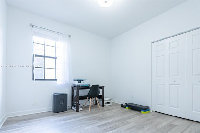 office with light hardwood / wood-style floors