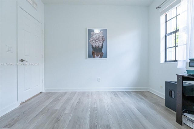 spare room featuring light hardwood / wood-style floors