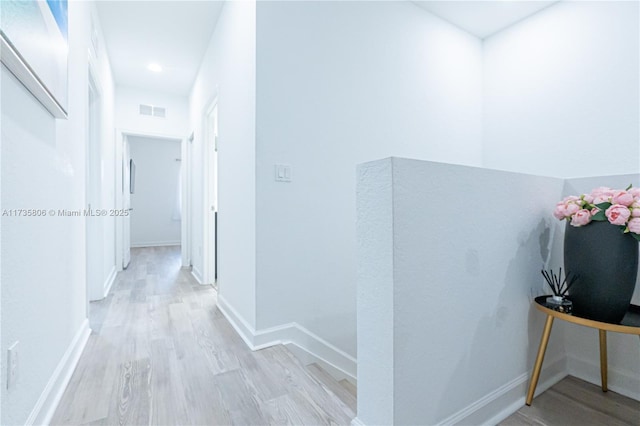 corridor featuring light hardwood / wood-style floors