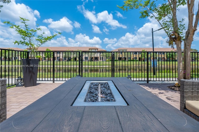 view of patio / terrace with an outdoor fire pit